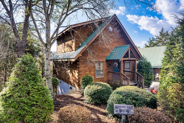 Embrace the tranquility of nature with this charming house featuring a lush green roof, nestled among the whispering trees 