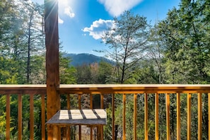 Step into serenity with this charming wooden deck setup, perfect for enjoying your morning coffee or a good book