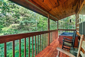 Dreaming of relaxing evenings on this cozy wooden porch with a bubbling hot tub, surrounded by nature's beauty.