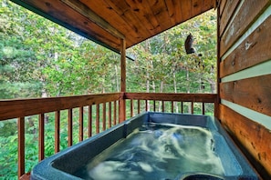 Immerse yourself in luxury with this inviting hot tub perched on a charming wooden deck.