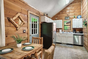 Step into rustic charm with this cozy kitchen and dining area in a cabin. 🏡✨ Perfect for family gatherings and heartwarming meals.