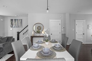 Create lasting memories while experiencing the joy of shared meals on this welcoming dining table.