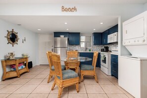 Our kitchen table seats 4, comfortably. The unit also includes a washer and dryer.