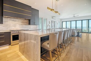 Chef's dream kitchen with seating for 7 at the island