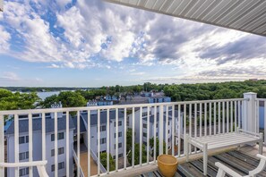 The balcony offers stunning views of the water and surrounding greenery, perfect for enjoying peaceful mornings or evenings. A serene outdoor space to relax and unwind.