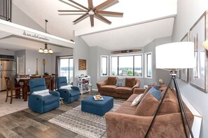 Welcome to At the 19! You'll enjoy the open living spaces, featuring a cozy stone fireplace and comfortable new furnishings accented by a soft area rug and decorative touches.