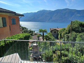 Cloud, Sky, Water, Building, Daytime, Property, Window, Mountain, Plant, Azure