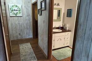 Hall, bathroom to the right.