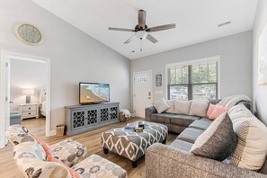 Step into our living room, where you'll find an inviting space complete with a comfortable sofa, ideal for relaxation.
