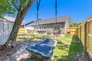 Enjoy lazy afternoons on the swing or gather around the patio.