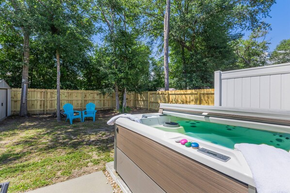 Enjoy a relaxing soak in the hot tub surrounded by nature.