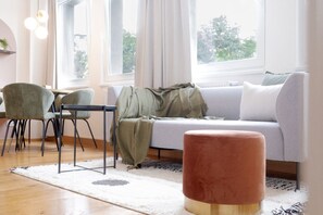 comfortable sofa and round ottoman