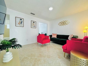 Our living room, every corner is designed to provide you with a warm and welcoming atmosphere, ideal for sharing special moments.