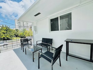 Welcome to the outside of the apartment, the patio, an outdoor oasis where you can enjoy a serene and charming atmosphere