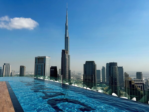 Serene infinity pool with skyline backdrop