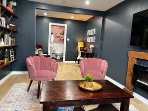 Pop of pink, splash of charm – this inviting lounge is your new favorite hangout.