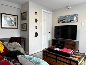 Stylish living room, featuring a cozy sofa and TV