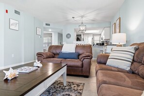 Living area, looking back towards kitchen. Larger sofa is sleeper sofa. 