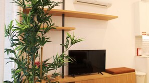 Our living area counts with a flat screen TV for your entertainment.