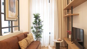 This comfortable couch turns into a sofa-bed, so the apartment can accommodate a third person.
