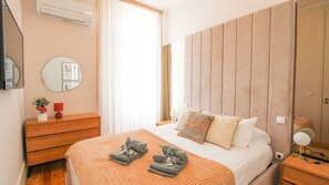 Cozy bedroom with a comfortable mattress, TV and access to the balcony. Crips clean linen included! #cozy #bedroom