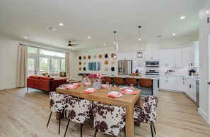 Dining area for 8 in an open floor plan concept with the kitchen and living room