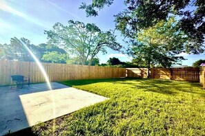 private fenced yard with patio