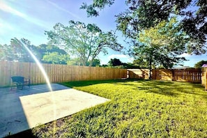 private fenced yard with patio