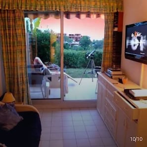Living room, flat screen tv, sofabed & double doors onto bbq/ terrace/ garden.