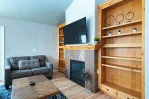 55 inch Smart TV and cozy gas fireplace