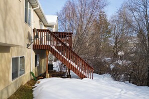 A spacious back deck opens from dining room and includes a gas BBQ grill