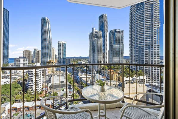 Enjoy your morning coffee in this balcony with the city and the ocean views