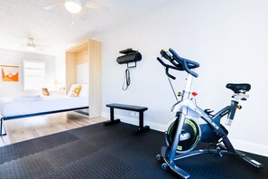 Second bedroom is equipped with a dedicated workspace, queen Murphy Bed, and exercise space