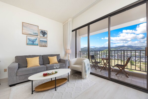1BR unit with a pull-out sleeper sofa in the living room and great mountain views