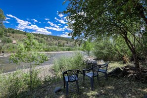 Step into your backyard and enjoy the shady riverfront views!