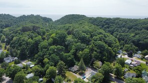 OVERALL:  The famous dunes of Elberta and Lake Michigan in the background with the home at the bottom center of the photo.