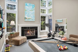 Here is the entertainment room with pool table and exercise bike