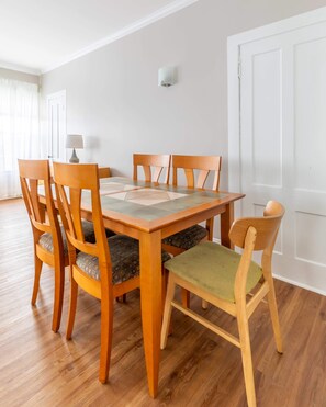 A  dining area for sharing a home cooked meal prepared in the apartment or a delicious spread from Burlingtons best restaurant Pho Hong located just across the street from the house