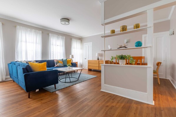 The bright and spacious living room in this large 3 bedroom apartment is a focal point and a wonderful space to gather and make memories