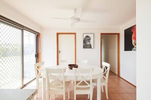 Gather around the six-seater dining table for meals at home. 