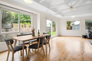 Share meals around the six-seater table in the open-plan dining area. 
