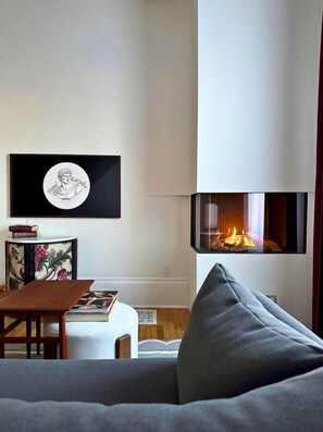 Cozy up by the fire and indulge in a classic novel from the bookshelf, a glass of wine in hand of course