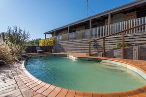 The swimming pool is beautifully landscaped and is complete with sun loungers to dry off after a dip. 
