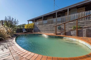 The swimming pool is beautifully landscaped and is complete with sun loungers to dry off after a dip. 
