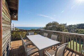 Dine alfresco on the rear deck, where a BBQ and outdoor setting overlook stunning views of the bay.  
