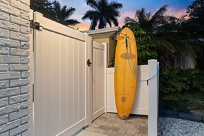 Custom surfboard shower for rinsing off after a day at the beach.
