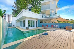 Cool down with a refreshing dip in the shared sparkling lap pool before drying off on the deck. 

