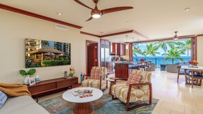 Spacious open concept living room with  comfortable modern chairs.
