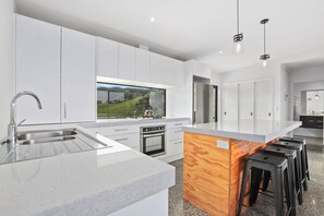 Entertain in a clean and modern kitchen with world-class views