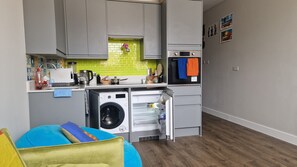 Unique kitchen area with modern appliances and utensils